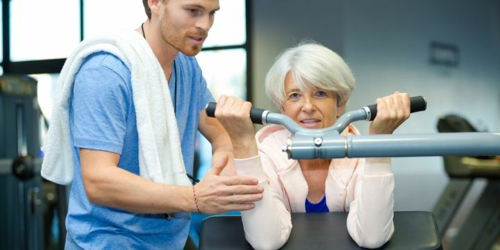 Elderly woman in the gym