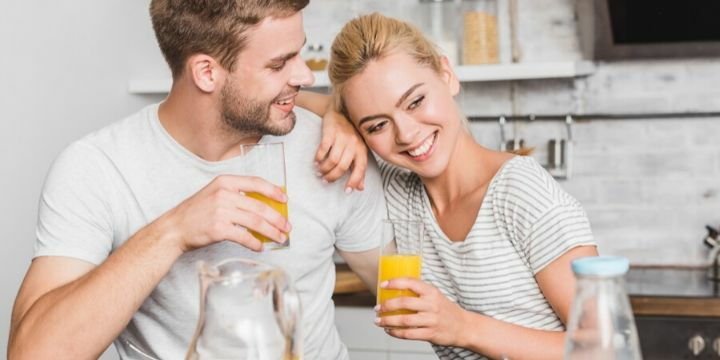 Couple drinking orange juice rich in vitamin C