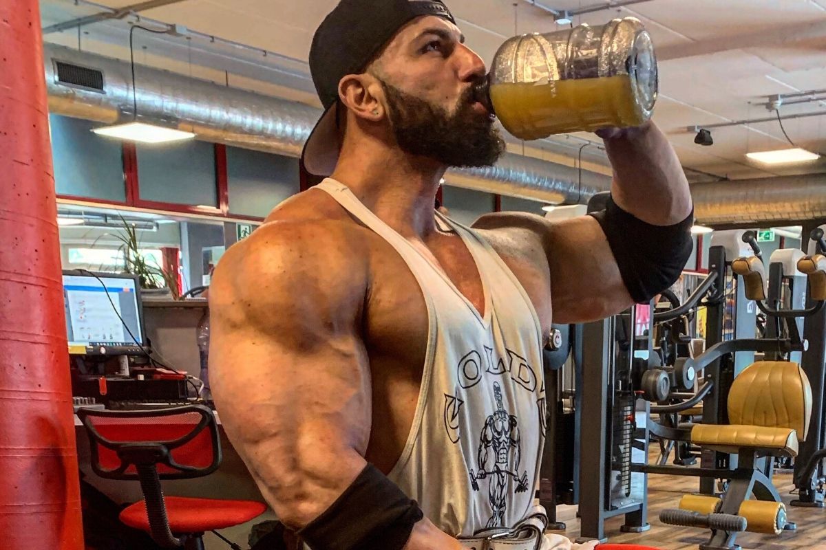 bodybuilder taking a pre-workout 